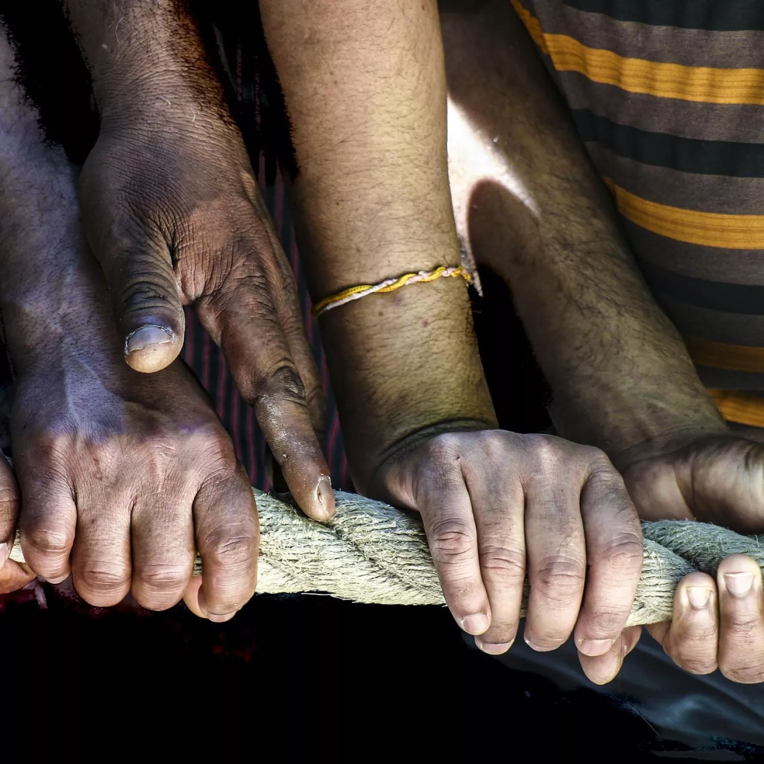 image of hands holding a rope