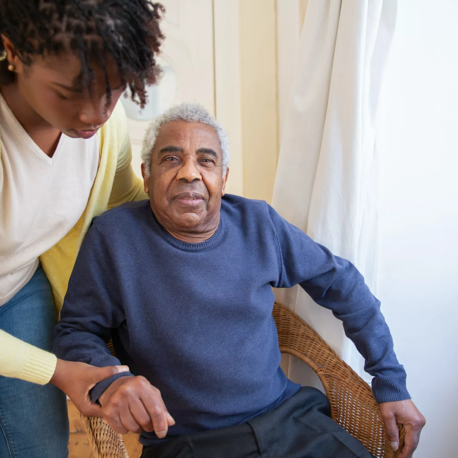 image of elderly person and assistant